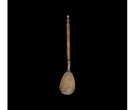 16th century AD. A Scandinavian bone spoon with silver band for attaching the bowl to handle; bowl is wide with shallow dish;