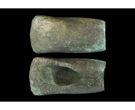 2nd millennium BC. A bronze chisel with slightly convex blade, round socket to the rear completed by closure at the top of tw