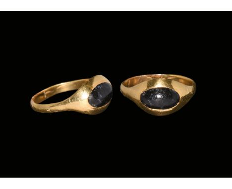 1st century AD. A D-section gold hoop with scaphoid plaque, inset glass cabochon. Cf. Ruseva-Slokoska, L. Roman Jewellery, So