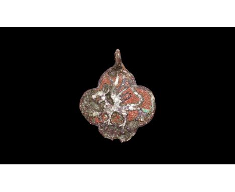 13th-14th century AD. A quatrefoil harness pendant with pierced suspension lug, red enamel field with reserved griffin passan