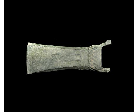 2nd millennium BC. A bronze axehead of European type with straight edge, square-section blade with ribs to both broad faces, 