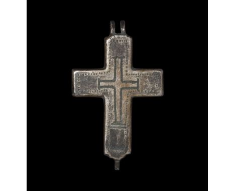 9th-10th century AD. A bronze encolpion, or reliquary cross, engraved with punched dot border with central cross; hinges to t