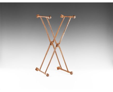 1st-4th century AD. An iron folding stool frame or stand with ribbed balusters, legs each with square-section central element