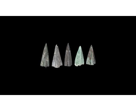 6th-4th century BC. A group of five bronze triangular-section socketted arrowheads.   14 grams total, 28mm (1 1/4"). Property