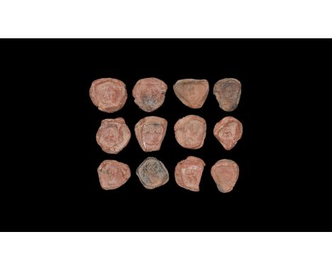 1st-3rd century AD. A mixed group of discoid ceramic theatre tokens or seals with impressed motifs from intaglio matrices, ma