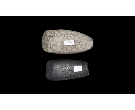 Neolithic, 5th-3rd millennium BC. A mixed pair comprising: an epidiorite semi-polished axe from Henry Dewey collection with c