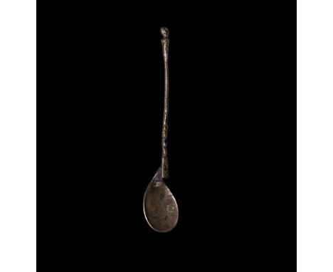 1st-2nd century AD. A silver spoon with teardrop bowl, offset junction to the shank with balustered lower end, round-section 
