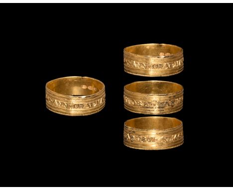 Dated 21st March 1801. A flat-section gold hoop with beaded edges and corrugated profile, band of reserved text to the middle