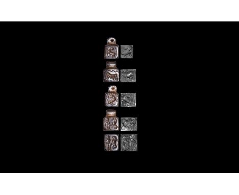 3rd-7th century AD. A cuboid haematite stamp seal with pierced suspension lug, images to the five faces comprising two rearin