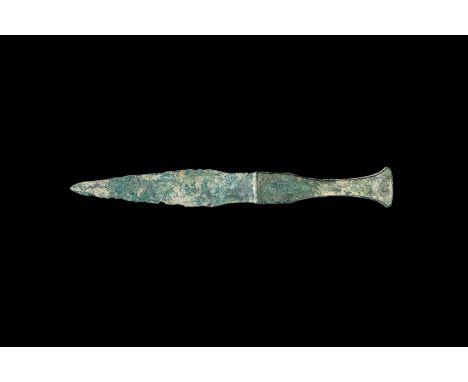13th-6th century BC. A short bronze flange-hilted dagger with waisted leaf-shaped two-edged blade, hollow grip with socket to