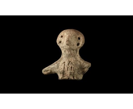 Neolithic, 6th-4th millennium BC. A ceramic head and upper torso of a female figure, wide round head with small nose and two 