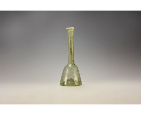 1st century AD. A pale green flask with indented bottom, conical body and tapering neck; the rim everted.   66 grams, 17cm (6