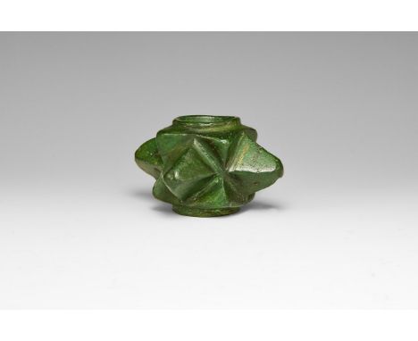 13th-15th century AD. A bronze macehead with four pyramidal projections and a waisted square core with circular shaft hole, f