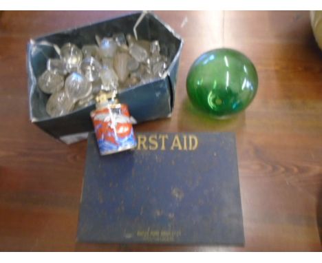 A vintage first aid kit with some contents, a hand blown glass ball, Oriental table lighter and a box of decanter stoppers