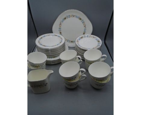 Royal Doulton 'Pastorale' part tea set comprising 1 cake serving plate, 8 cake plates, 12 side plates, 12 saucers, 10 cups an