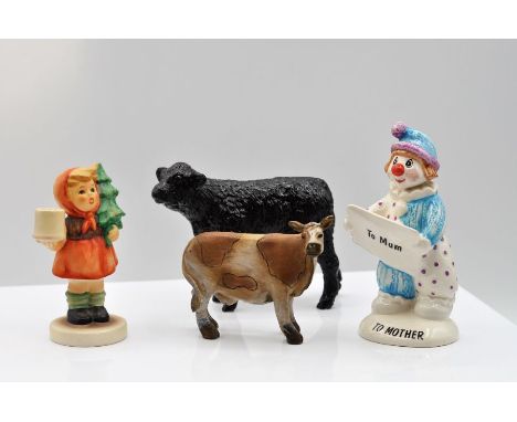 Goebel child carrying a Christmas tree; Beswick Clown; Galloway calf figurine and a figurine of a cow 