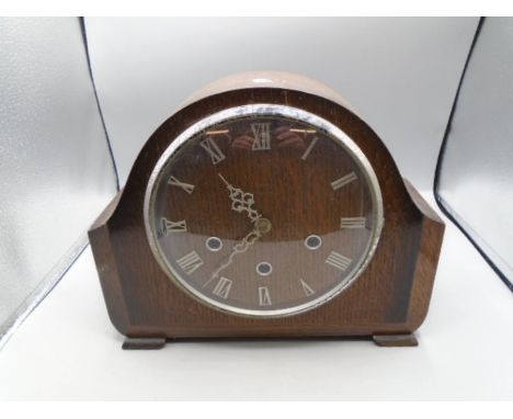 Oak cased mantel clock with key