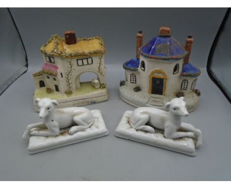A pair of vintage china dogs and 2 tea light cottages