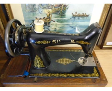 vintage Singer sewing machine in wooden box with leaflet and original oil