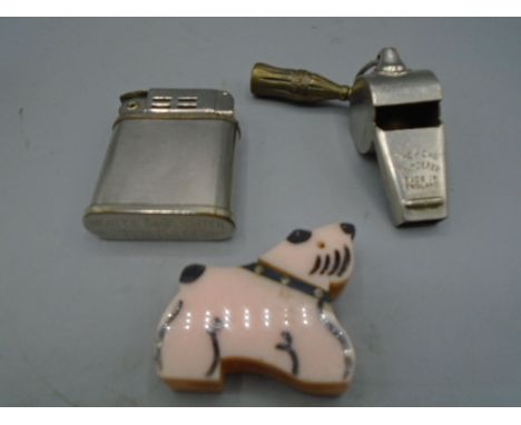 Beattie lighter, an unusual lighter in the form of a dog and a acme whistle