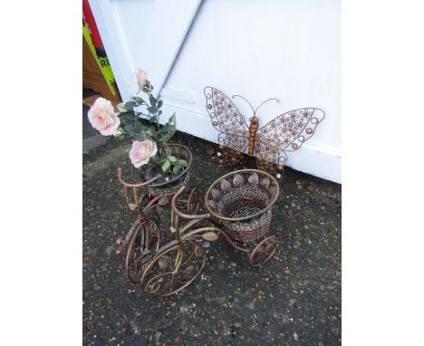 2 metal bicycle planters and metal butterfly wall art 