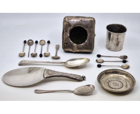 A collection of small silverware, to include; a French silver sifting spoon, a Georgian old English pattern silver table spoo