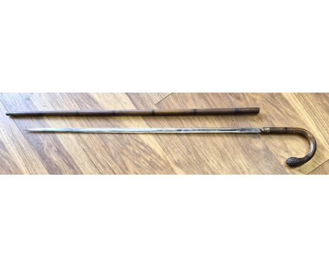 A late 19th/early 20th century sword stick, the the bayonet fitting tapering stick and curved handle fashioned from metal wit