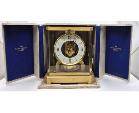 A Jaeger LeCoultre Atmos brass cased mantle clock, cal.526-6, having signed white chapter ring with applied baton and quarter