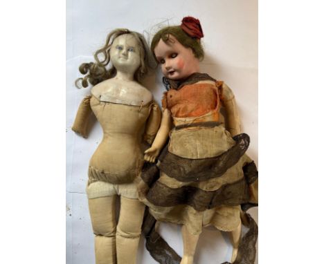 A 19th cent wax doll and a bisque headed doll