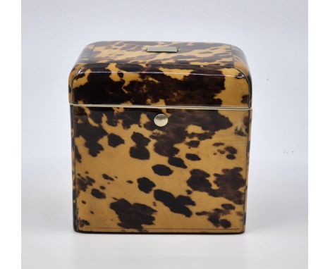 A Regency tortoiseshell and ivory strung tea caddy, c.1815, of rectangular form, the hinged lid with silver stringing and pre