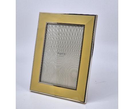 An Asprey silver and pale yellow guilloche enamel easel back rectangular photograph frame, makers mark for Asprey & Co Ltd, L