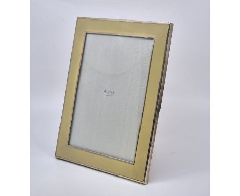 An Asprey silver and pale yellow enamel easel back rectangular photograph frame, makers mark for Asprey & Co Ltd, London 2011