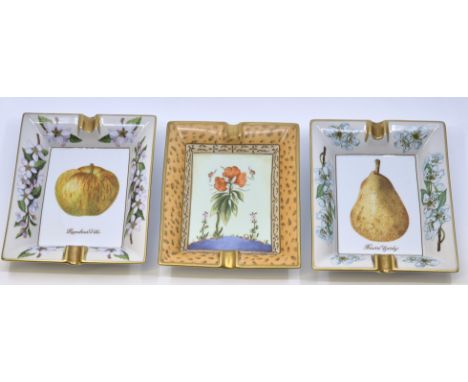Three Hermes porcelain hand painted rectangular ashtrays; to include two with hand painted fruit reserves and blossom border 