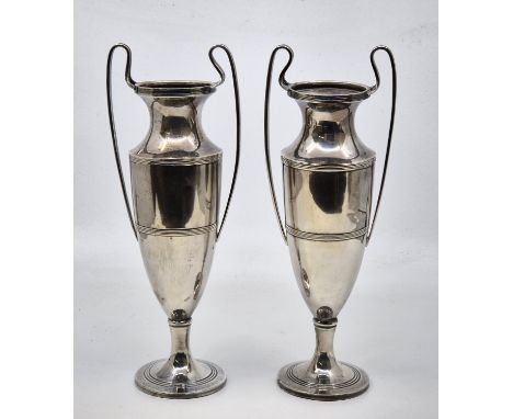 A pair of silver twin handled vases in the Neo-classical style, by William Hutton &amp; Sons Ltd, Birmingham 1913, with weigh
