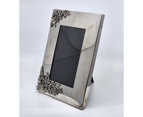 A Giovani Raspini Italian sterling silver rectangular easel back photograph frame, with applied silver shellfish and coral mo