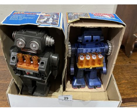 Two battery operated robot toys.