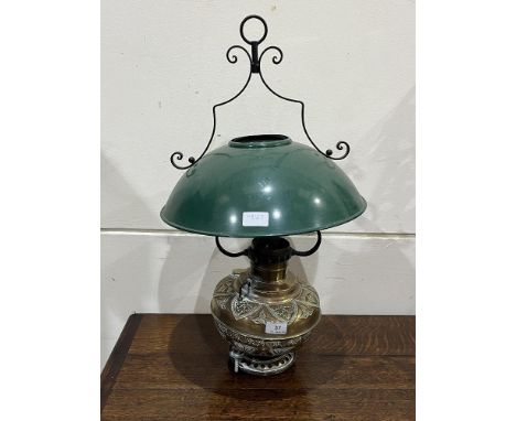 A brass hanging lamp with enamel shade.