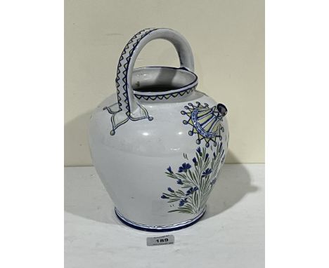 A Gallé Nancy spouted ceramic vessel painted with flowers in red, green and yellow. Signed. 11" high.