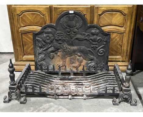 An inglenook cast iron fire grate, andirons and fire back. The grate 35" wide.