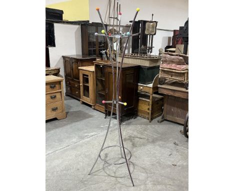 A modernist design tubular chrome plated hat and coat stand. 71" high.