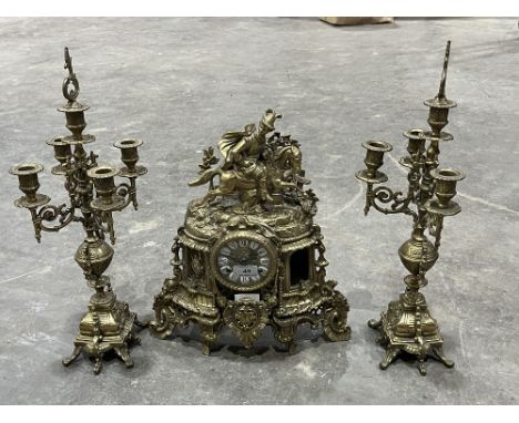 A brass clock garniture. (Losses)