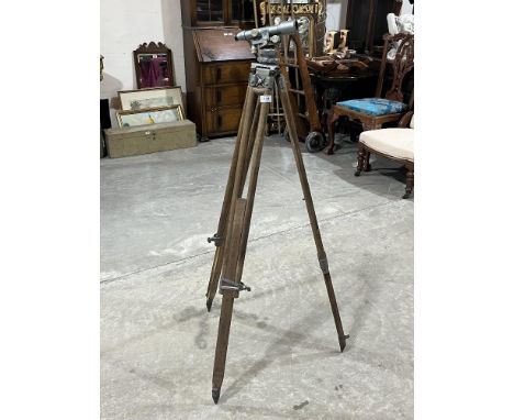 A Mall Bros. Survey theodolite on tripod stand.