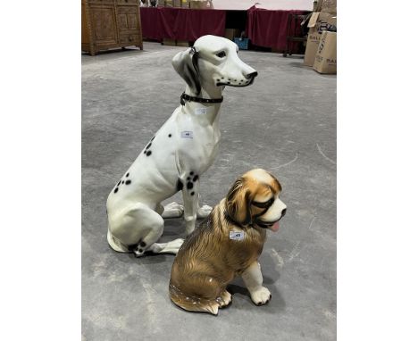 A composition model of a seated dalmatian, 27" high and a smaller ceramic St. Bernard.