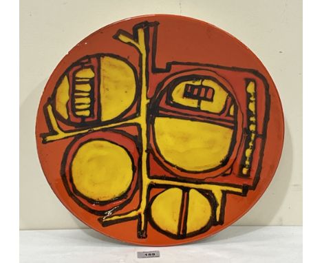 A Poole Pottery Delphis charger, shape 54; decorated by Carol Cutler. 16" diam.