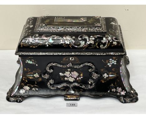 An early Victorian papier-mache and mother-of-pearl inlaid tea caddy in the manner of Jennens and Bettridge. 18" w x 10" h (o