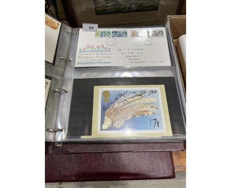 Two albums of first day covers.
