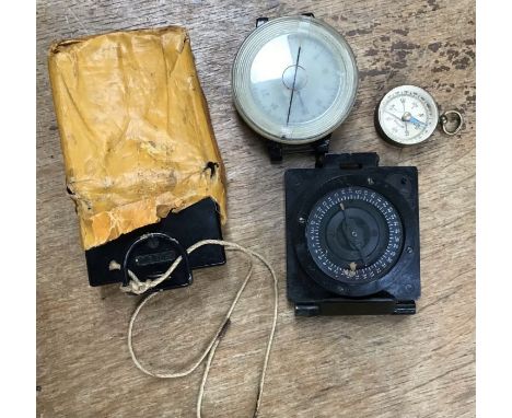 WW2 Marching Compass in Original issue cover bag with three other compasses.