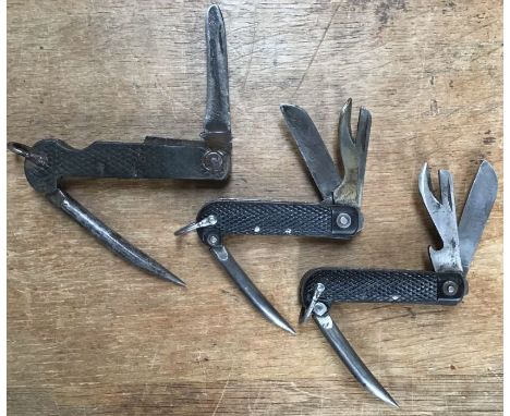 Three British military Combination tools one WW1 (unmarked) one WW2 dated 1943 and one post War dated 1946.