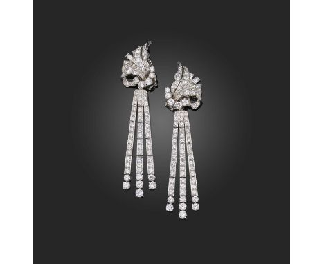 A pair of diamond earrings, of 'Day &amp; Night' design, each composed of a foliate surmount suspending a detachable articula