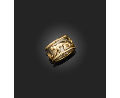 Cartier, a gold ring, 'Panthère', the wide band decorated with a frieze of panthers in bicoloured gold, size M1/2, signed Car